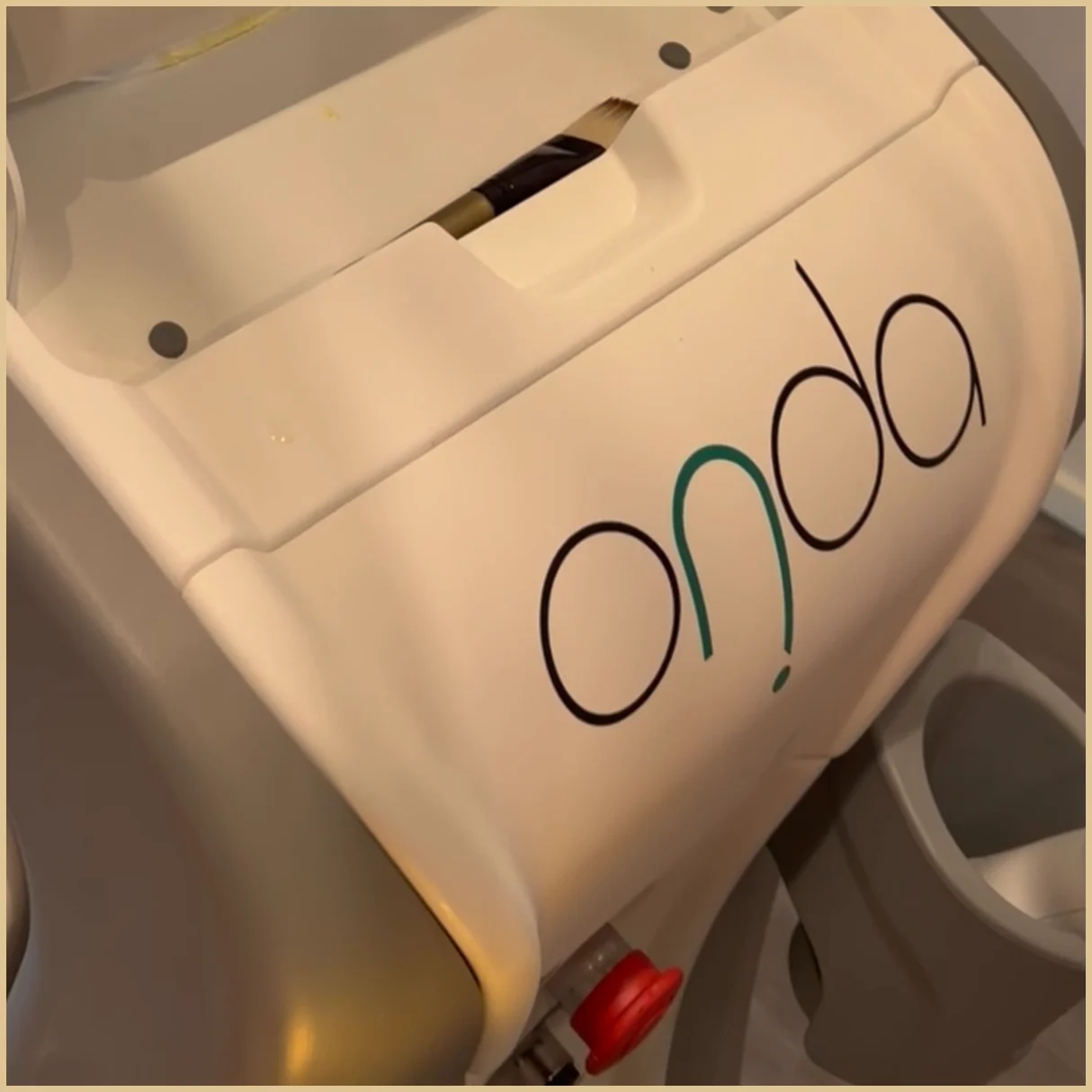 Lower casing of a treatment device with the ONDA name printed in large letters