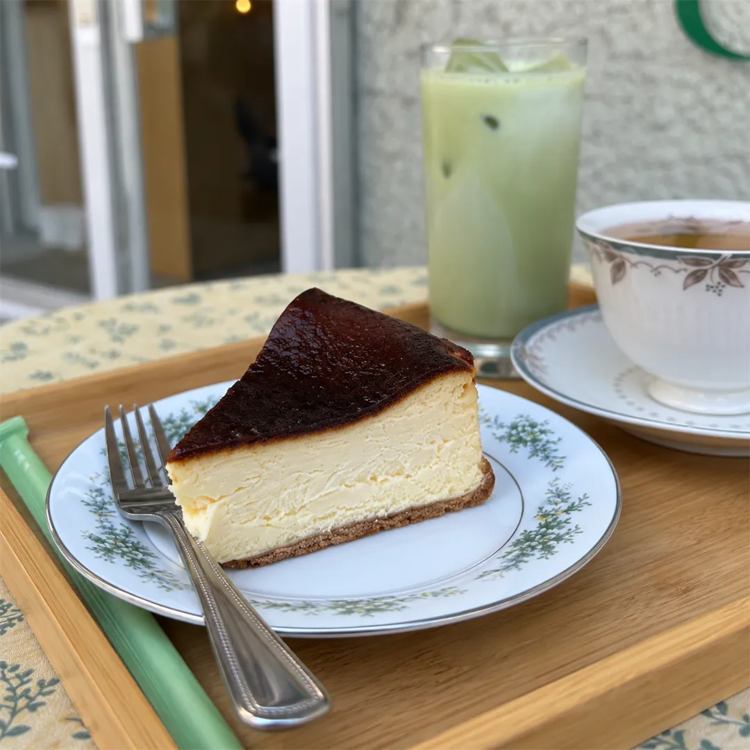 Close-up of a cake slice with a dark top and a pale yellow inner layer