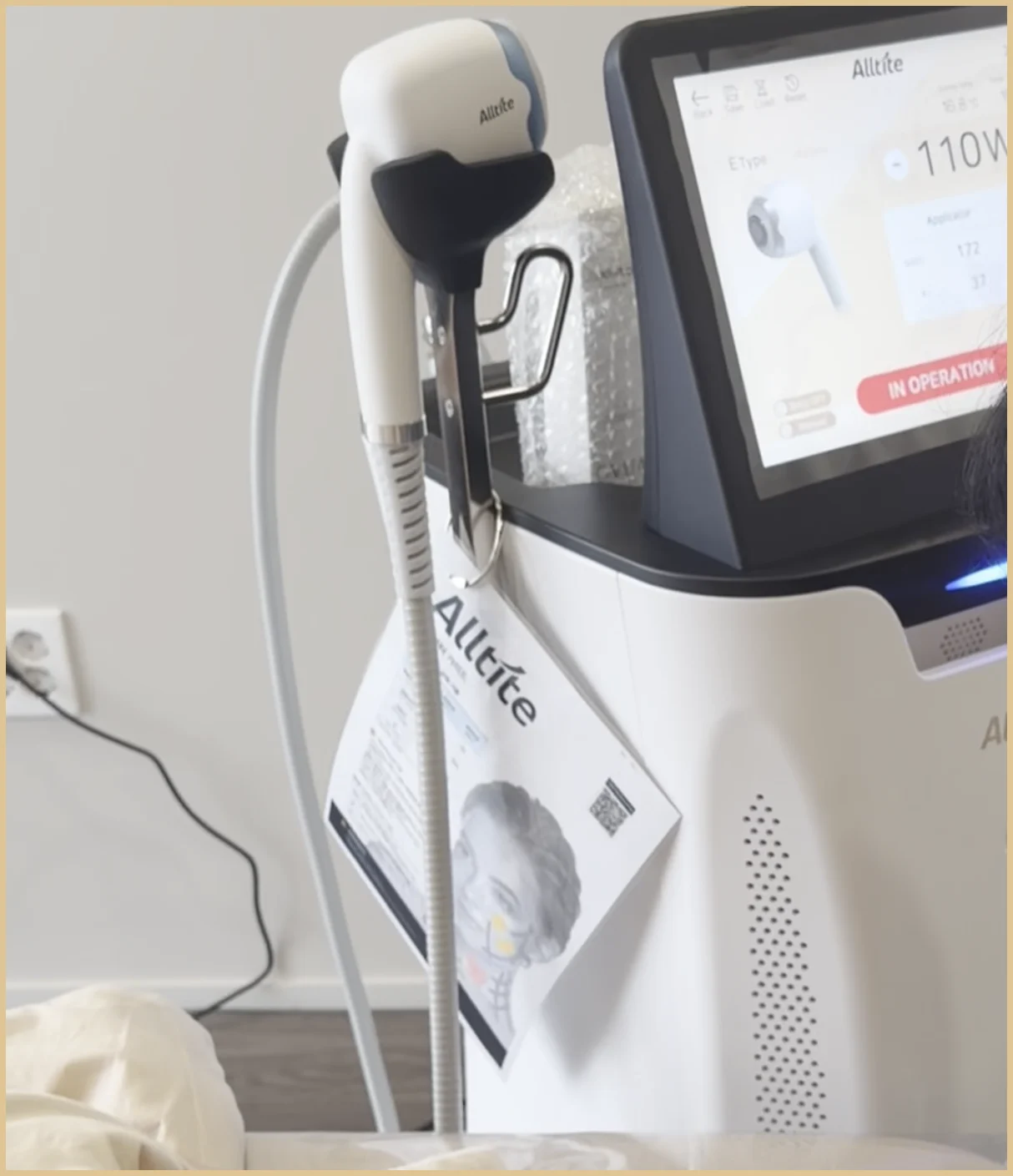 Alltite RF console with the handpiece resting in its holder in a clinic